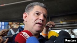 FILE - President of the Social Liberal Party (PSL) Gustavo Bebianno arrives at Albert Einstein hospital where presidential candidate Jair Bolsonaro is hospitalized in Sao Paulo, Brazil, Sept. 29, 2018.