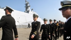 FILE - Taiwan navy sailors and officers at Suao port in Yilan county, northeast of Taiwan, Dec. 23, 2014.