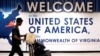 FILE - A man exits the transit area after clearing immigration and customs on arrival at Dulles International Airport in Dulles, Virginia, Sept. 24, 2017. 