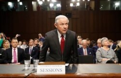 FILE - Attorney General Jeff Sessions arrives on Capitol Hill in Washington, June 13, 2017, to testify before the Senate Intelligence Committee.