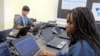 FILE - In this March 13, 2019, photo, Bennett High School students work on laptops in a school computer lab in Buffalo, N.Y.