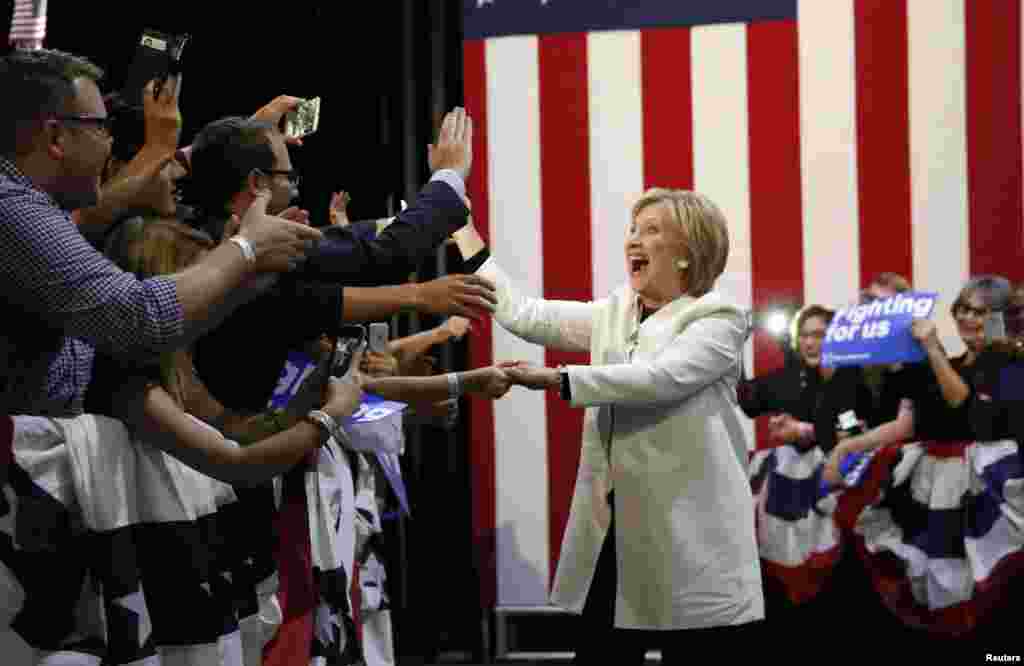 Democratic U.S. presidential candidate Hillary Clinton greets supporters as she arrives to speak at her Super Tuesday night party in Miami, Florida, March 1, 2016.
