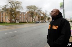 Demeatreas Whatley, a supervisor for Cure Violence, a group that works to stem gang violence, stands on a street on the South Side of Chicago, Nov. 9, 2018.