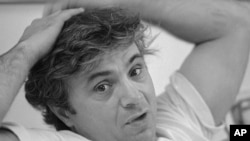 FILE - Robert Blake speaks in April 1977 in Los Angeles. Blake, the Emmy award-winning performer who went from acclaim for his acting to notoriety when he was tried and acquitted of murdering his wife, died March 9, 2023, at age 89.