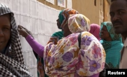Women look for their names during Darfur's referendum at a registration center at Al Fashir in North Darfur, Sudan, April 12, 2016.