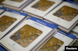 Pope Francis' new encyclical titled "Laudato Si (Be Praised), On the Care of Our Common Home", is displayed during the presentation news conference at the Vatican, June 18, 2015.