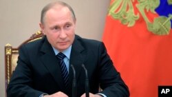 Russian President Vladimir Putin chairs a Security Council meeting in Moscow, June 16, 2017.