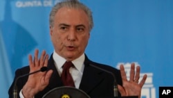 Brazil's President Michel Temer talks to press during a joint news conference at the government's official residence in Buenos Aires, Argentina, Oct. 3, 2016. 