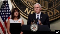 Vice President Mike Pence, accompanied by his wife, Karen, speaks in Las Vegas, Oct. 7, 2017, following a unity prayer walk honoring the victims of the recent massacre. Pence's brother, Greg Pence, announced Oct. 18, 2017, he will run for a congressional seat in Indiana. 