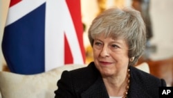 Britain's Prime Minister Theresa May talks with Poland's Prime Minister Mateusz Morawiecki during their bilateral meeting ahead of the UK-Poland Inter-Governmental Consultations, inside 10 Downing Street in London, Dec. 20, 2018. 