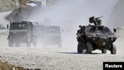 Turkish troops patrol in Hakkari province, southeastern Turkey, June 19, 2010. 