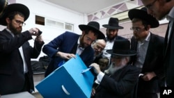 Ultra-orthodox man votes during elections in Bnei Brak, Israel, Monday, March 2, 2020. 
