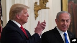 FILE - President Donald Trump listens as Israeli Prime Minister Benjamin Netanyahu speaks during an event at the White House in Washington, Jan. 28, 2020, to announce the Trump administration's plan to resolve the Israeli-Palestinian conflict.