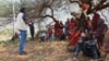 Indigenous Kenyan men attend a training session on ending female genital mutilation in Olmoti village, Kajiado County, Kenya in April 2024.