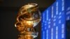 FILE - Golden Globe trophies are set by the stage ahead of the 77th Annual Golden Globe Awards nominations announcement at the Beverly Hilton hotel in Beverly Hills on Dec. 9, 2019.