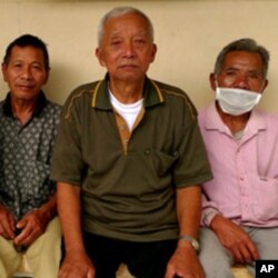 Male evacuees make the best of their circumstances, but many say they're bored at the shelters already