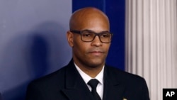 FILE - U.S. Surgeon General Jerome Adams attends a coronavirus task force briefing at the White House, in Washington, March 22, 2020. 