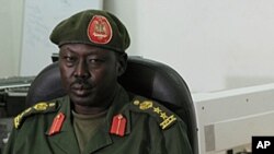 SPLA spokesman Philip Aguer, shown here at a briefing in March 2012, says five soldiers who were found guilty of murdering civilians in Jonglei state could be put to death. 