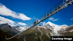 Opening of the world's longest pedestrian suspended bridge (494m) on the Europaweg in Randa, Switzerland, Saturday July 29, 2017. (PHOTOVF/Valentin Flauraud via Zermatt Tourism)