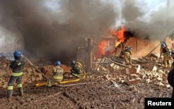 Rescuers work at the site of a Russian military strike in Sumy region, Ukraine, Feb. 27, 2024. (Press service of the Ministry of Internal Affairs of Ukraine/Handout via Reuters)