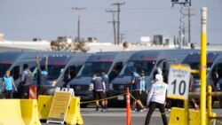 FILE - Amazon drivers cheer as they go back to their delivery vans, with their logistics system back online, at the Amazon Delivery Station in Rosemead, Calif., Dec. 7, 2021. Amazon Web Services had suffered a major outage.