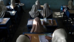 FILE - Afghan girls sit in a classroom at a school in Kabul, Afghanistan, September 18, 2021. (West Asia News Agency via Reuters)