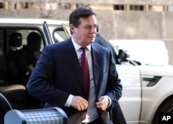 FILE - Former Trump campaign chairman Paul Manafort arrives at federal court in Washington, Monday, Dec. 11, 2017.