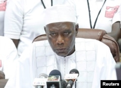 The president of Gambia's Independent Electoral Commission, Alieu Momarr Mjiar, announces presidential election results in Banjul, Gambia, Dec. 2, 2016.