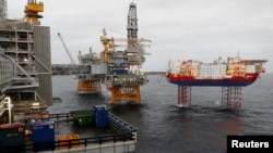 FILE - Equinor's Johan Sverdrup oilfield platforms and accommodation jack-up rig Haven are pictured in the North Sea, Norway, Dec. 3, 2019. 