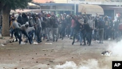 Demonstrators take the streets during anti-government protests, in Tebourba, south of the Tunisian capital, Tunis, Jan. 9, 2018.