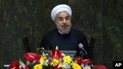 Iranian President Hassan Rouhani speaks during a debate in parliament on his proposed cabinet, in Tehran August 12, 2013.