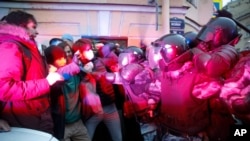 People clash with police during a protest in support of jailed opposition leader Alexey Navalny in St. Petersburg, Russia, April 21, 2021.