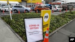 Cars line up at a pop-up community COVID-19 testing station at a supermarket lot in Christchurch, New Zealand, April 17, 2020.