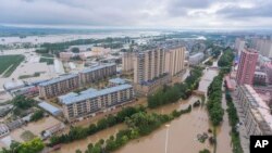 Air banjir menutupi wilayah Yanshou di Harbin di Provinsi Heilongjiang, China timur laut pada Sabtu, 5 Agustus 2023. (Foto:XInhua via AP)