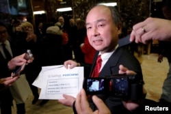 Softbank CEO Masayoshi Son speaks to the press after meeting with U.S. President-elect Donald Trump at Trump Tower in Manhattan, New York, Dec. 6, 2016.