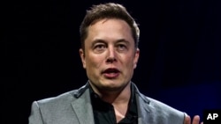 FILE - Elon Musk, CEO of Tesla Motors, unveils the company’s newest products in Hawthorne, California, April 30, 2015. 