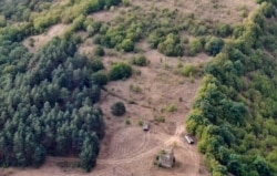 Russian military vehicles and personnel are reportedly seen from a birds-eye view near the village of Chorchana, Khashuri municipality, Georgia. (Social media)