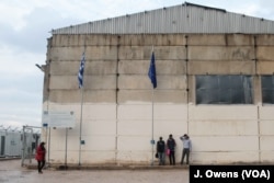 FILE - Refugees at Vial center on the Greek island Chios. Thousands of refugees remain stuck on the Greek islands closest to Turkey, unable to make it to the Greek mainland and facing the threat of deportation.