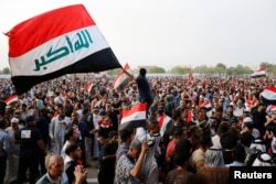FILE - Followers of Iraq's Shi'ite cleric Moqtada al-Sadr stage a protest within the Green Zone in Baghdad, Iraq, May 1, 2016.