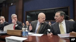 Director of National Intelligence James Clapper (second from right) and heads of other national security agencies gather on Capitol Hill to testify before the House Intelligence Committee, February 10, 2011