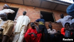 FILE - Parents attend a meeting at the Salihu Tanko Islamic school in Tegina, Niger state, Nigeria, Aug. 10, 2021.
