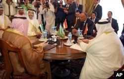 Seated from left clockwise at table, Saudi Foreign Minister Adel al-Jubeir, United Arab Emirates Foreign Minister Abdullah bin Zayed al-Nahyan, Egyptian Foreign Minister Sameh Shoukry, and Bahraini Foreign Minister Khalid bin Ahmed al-Khalifa meet in Cairo, Egypt, Wednesday, July 5, 2017.