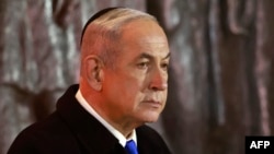 Israel's Prime Minister Benjamin Netanyahu speaks during a ceremony marking Holocaust Remembrance Day for the six million Jews killed during World War II, at the Yad Vashem Holocaust Memorial in Jerusalem on May 5, 2024. (Photo by Menahem Kahana / AFP)