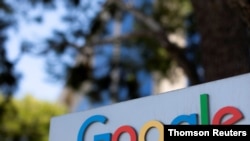 FILE - A Google sign is shown at one of the company's office complexes in Irvine, Calif.
