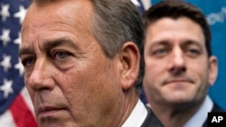 House Speaker John Boehner of Ohio, left, joined by House Budget Committee Chairman Rep. Paul Ryan, R-Wis., takes reporters' questions, on Capitol Hill in Washington, Dec. 11, 2013.