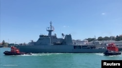  HMNZS Wellington departs with naval divers, hydrographers and a helicopter on board to assist with delivering supplies to Tonga after a volcanic eruption and tsunami, from Devonport Naval Base in Auckland, New Zealand January 18, 2022. 