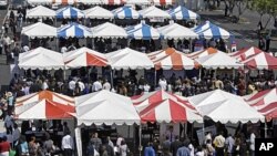 Dozens of employer booths are seen at a job fair called the "For The People Jobs Initiative," where job seekers met employers, job counselors, skills trainers and others, at Crenshaw Christian Center in South Los Angeles, August 31, 2011.