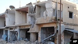 Shops and homes are seen after they were destroyed by Syrian government shelling in Rastan town in Homs province, central Syria, March 20, 2012. 