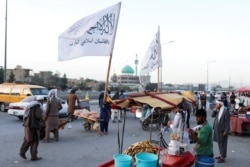 Taliban flags are seen on a street in Kabul, Afghanistan, Sept. 16, 2021