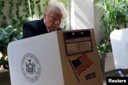 Republican presidential candidate Donald Trump fills his ballot for the New York primary election in the Manhattan borough of New York City, April 19, 2016.